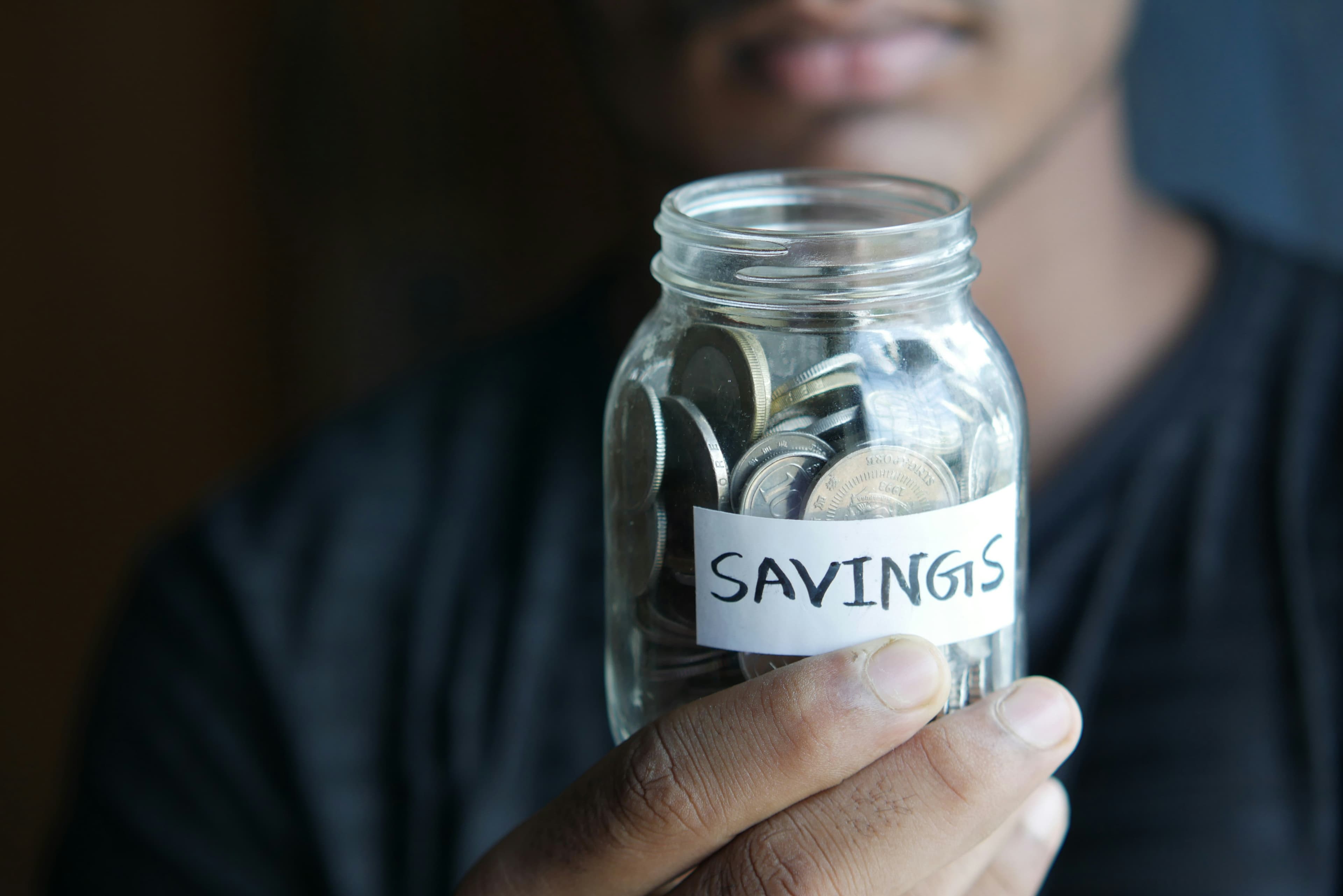 Savings jar with coins